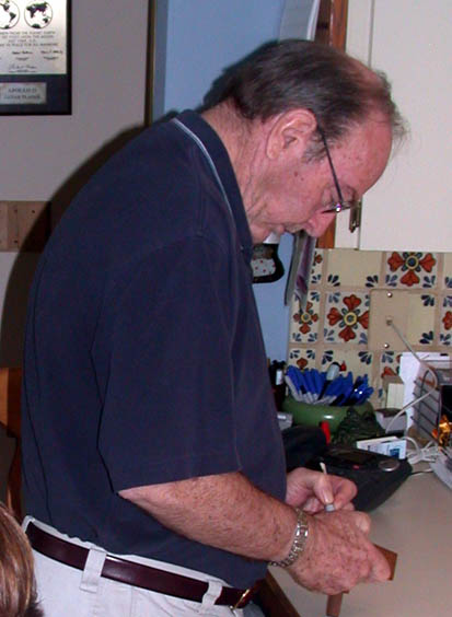 Ed Mitchell signs the momento