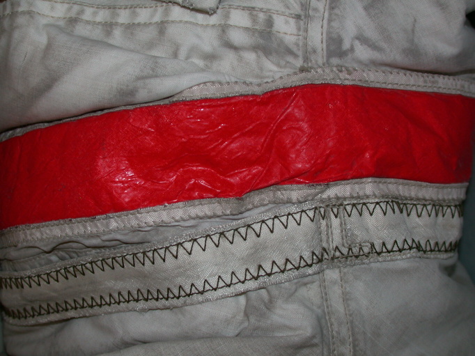 Red Stripe on John Young's left arm